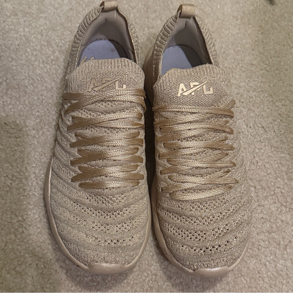 APL Metallic Champagne Knit Slip-On Sneakers